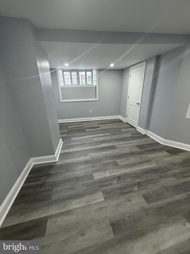 basement with dark wood-type flooring