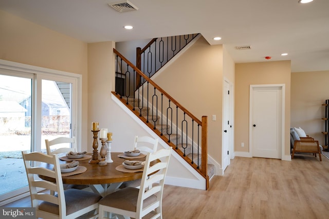 dining space featuring light wood-type flooring