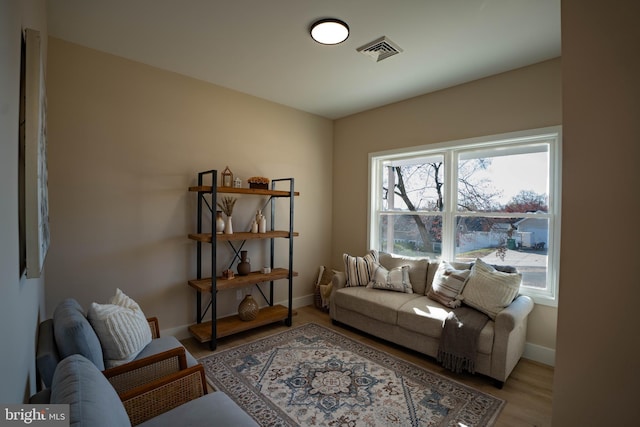 living room with light hardwood / wood-style flooring