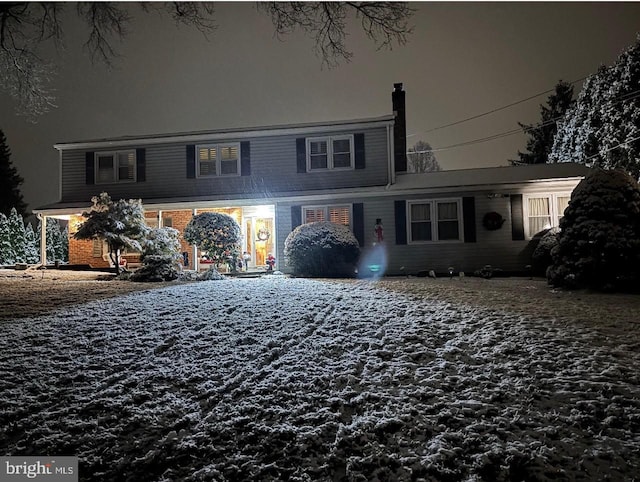 view of front of house featuring brick siding