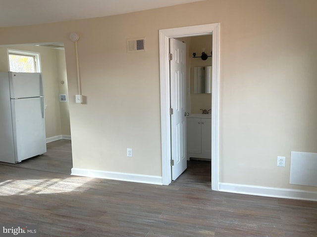 empty room with dark hardwood / wood-style floors