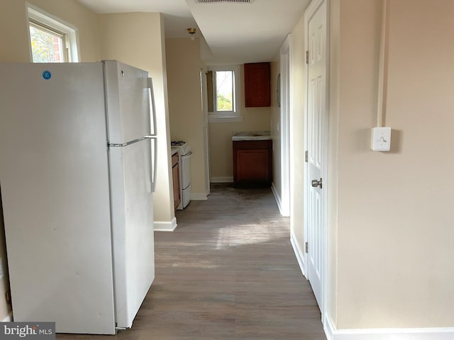 hallway featuring light wood-type flooring