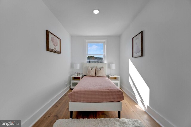 bedroom featuring hardwood / wood-style floors