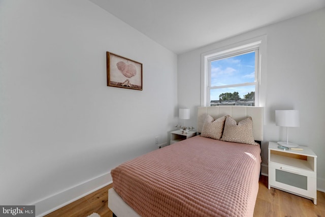 bedroom with light hardwood / wood-style floors