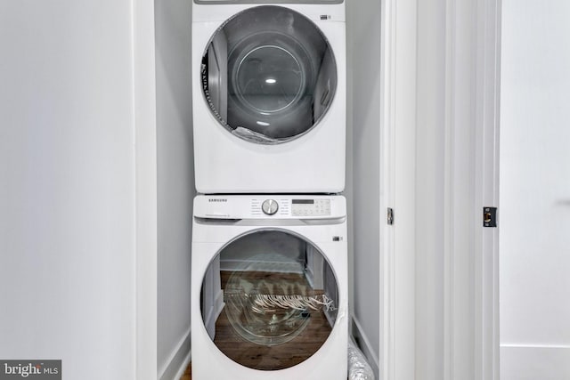 washroom featuring stacked washer and dryer