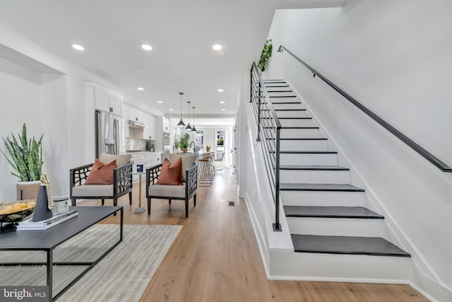 stairs with wood-type flooring