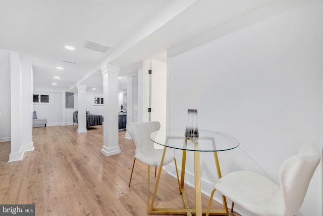 dining space with light hardwood / wood-style floors