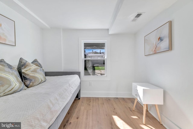 bedroom with light hardwood / wood-style floors