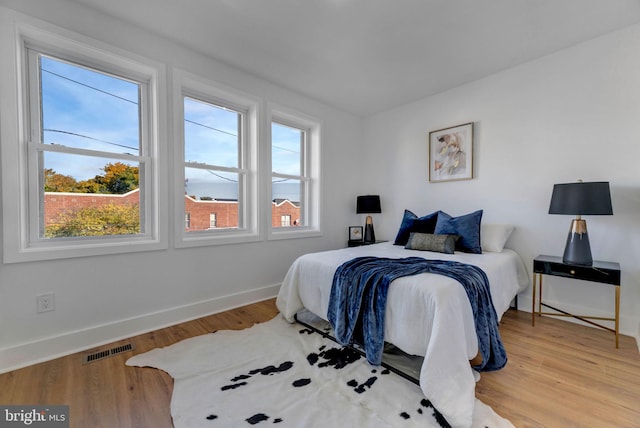 bedroom with light hardwood / wood-style floors