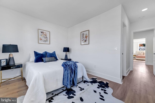 bedroom with light wood-type flooring