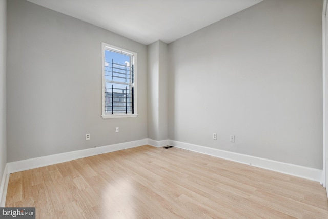 spare room featuring light hardwood / wood-style flooring