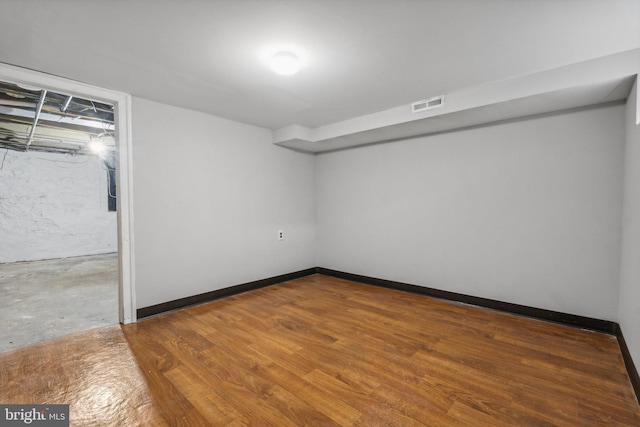 basement featuring hardwood / wood-style flooring