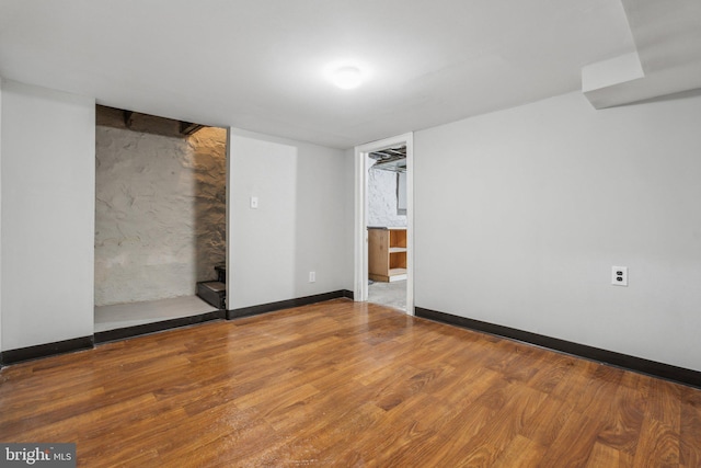 empty room with hardwood / wood-style floors