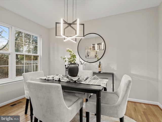 dining area featuring light wood-type flooring