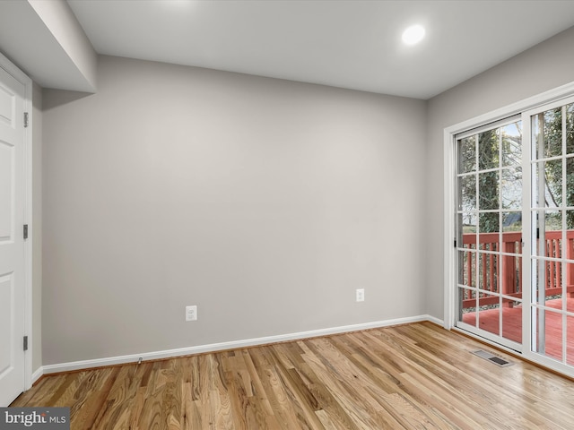 unfurnished room featuring light wood-type flooring