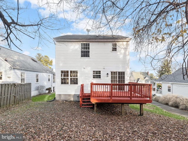 rear view of house with a wooden deck