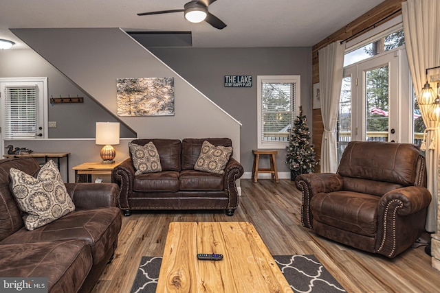 living room with ceiling fan and hardwood / wood-style floors