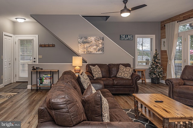 living room featuring hardwood / wood-style floors and ceiling fan