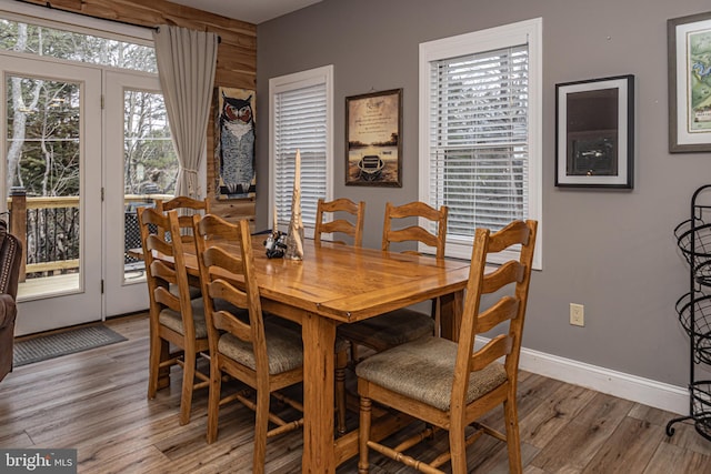 dining space with light hardwood / wood-style floors