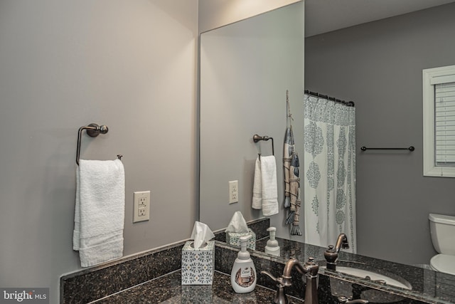 bathroom with vanity and toilet