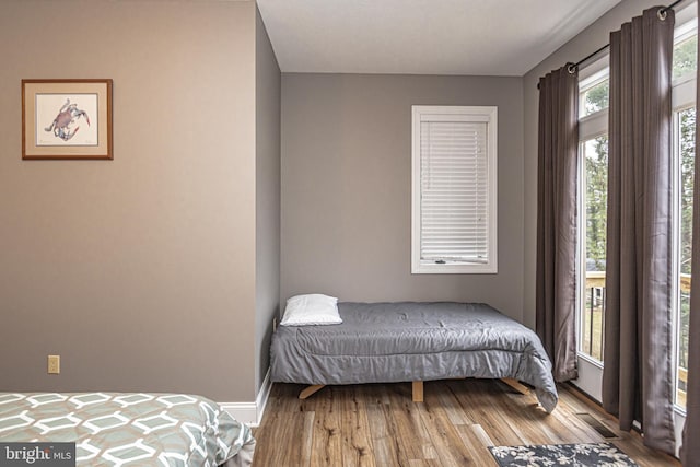 bedroom with hardwood / wood-style flooring