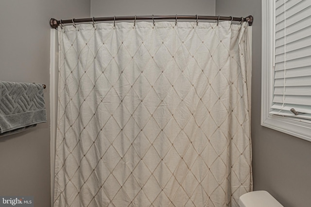 bathroom with curtained shower