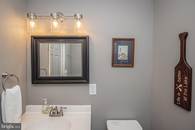 bathroom featuring toilet and sink