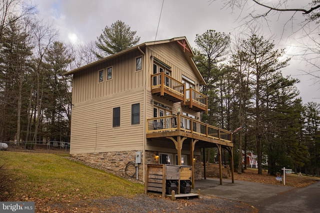 view of side of property with a yard