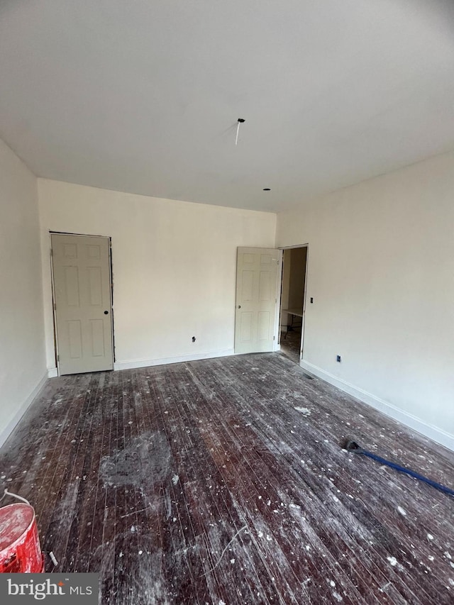 unfurnished room with hardwood / wood-style floors