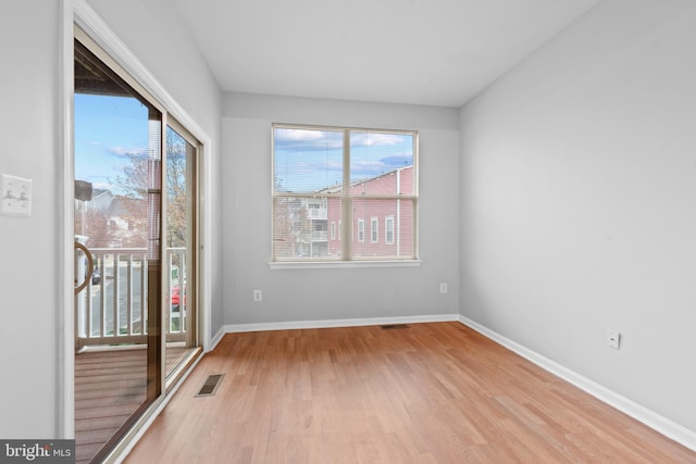 empty room with light wood-type flooring