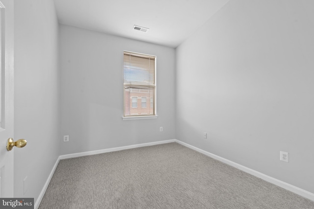 unfurnished room with carpet flooring