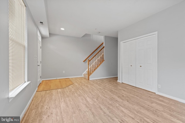 entryway with light hardwood / wood-style flooring