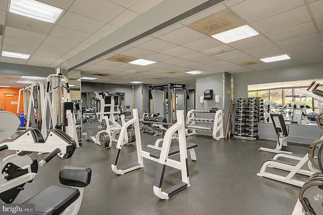 gym featuring a paneled ceiling