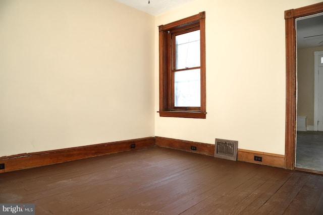 unfurnished room with ceiling fan and wood-type flooring