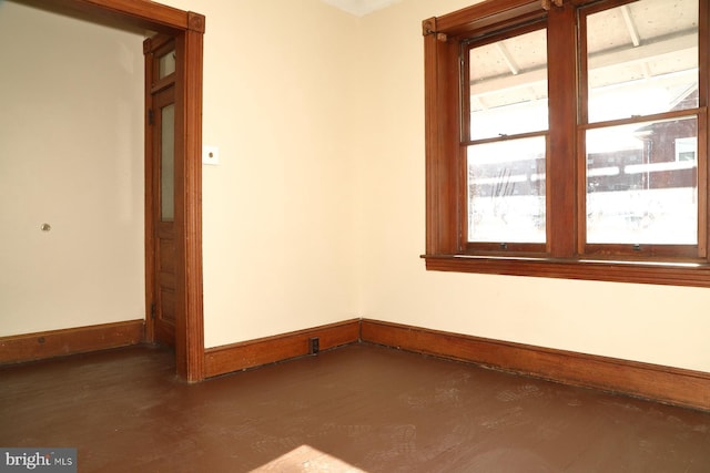 spare room with dark hardwood / wood-style flooring