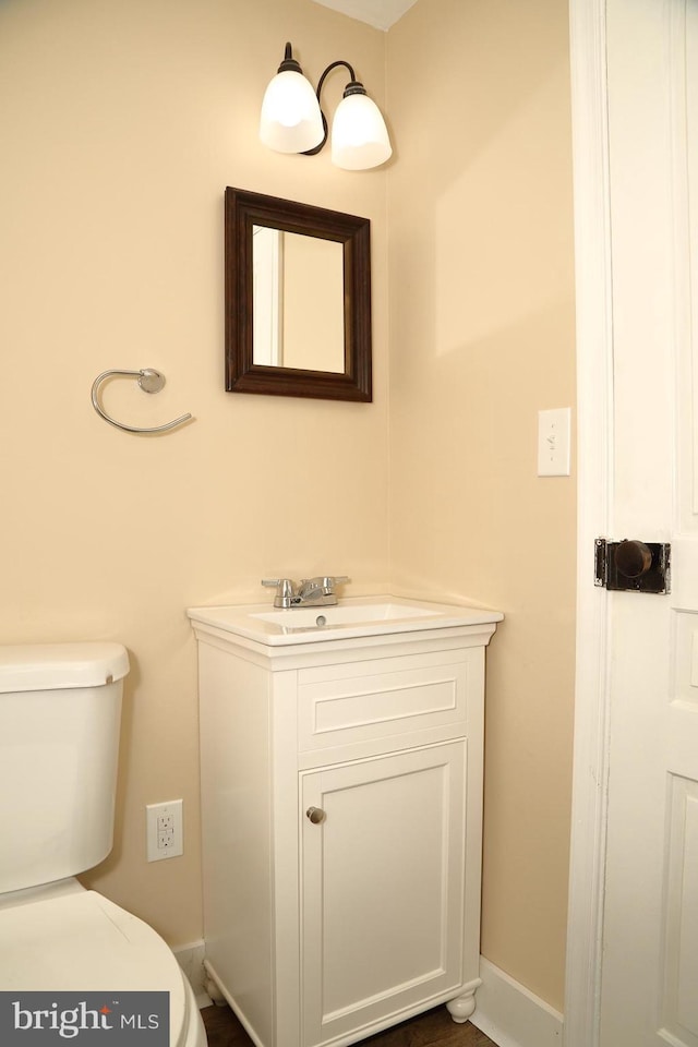 bathroom with vanity and toilet