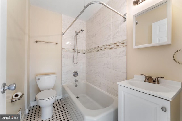 full bathroom with toilet, vanity, and tiled shower / bath combo