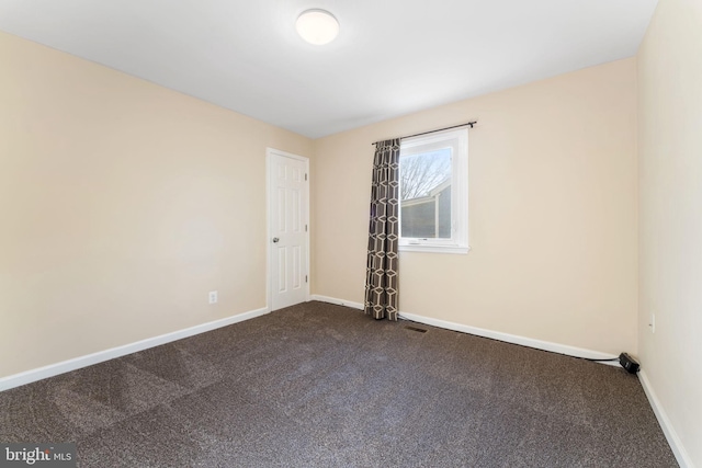 spare room featuring carpet