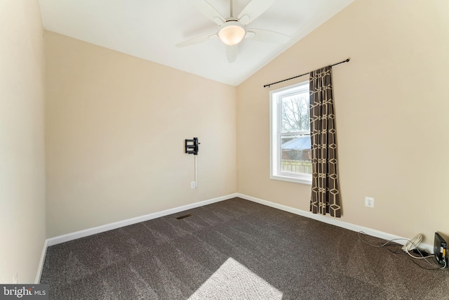 unfurnished room with lofted ceiling, ceiling fan, and carpet