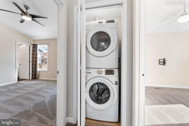 laundry area featuring carpet floors, stacked washer / dryer, and ceiling fan