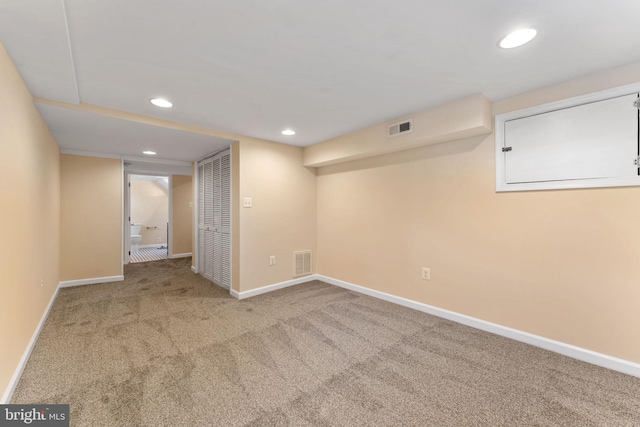 basement featuring carpet flooring