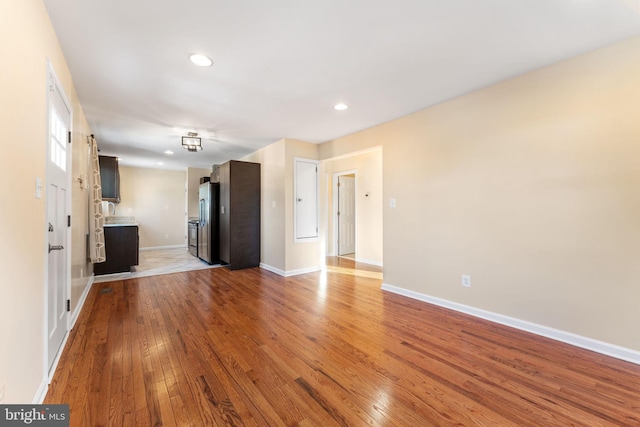 unfurnished living room with light wood-type flooring