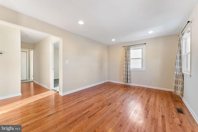 unfurnished room with light hardwood / wood-style flooring