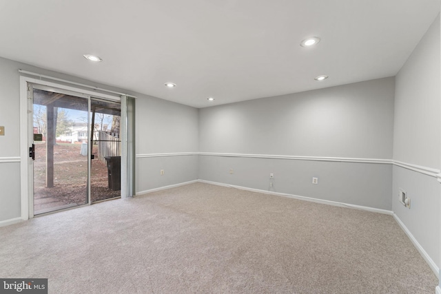 spare room with light colored carpet