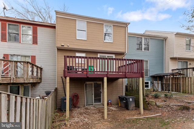 rear view of house featuring central AC unit