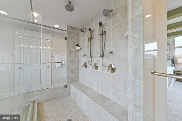 bathroom with a shower with shower door