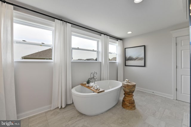 bathroom featuring a tub