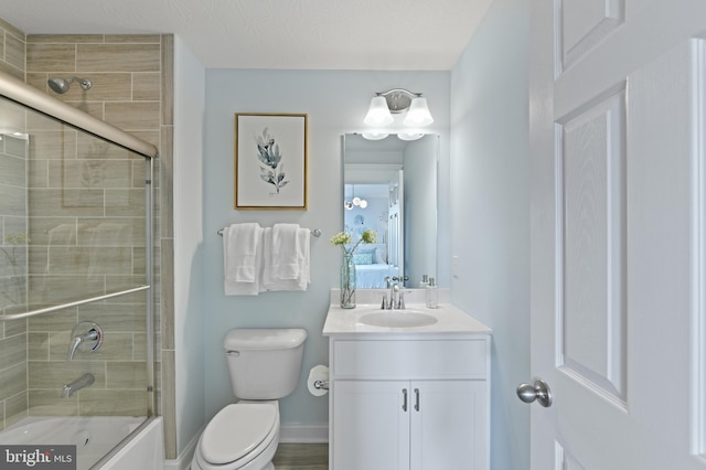 full bathroom with vanity, hardwood / wood-style flooring, toilet, and enclosed tub / shower combo