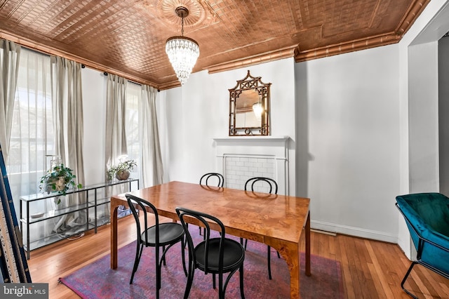 dining room featuring hardwood / wood-style floors and a notable chandelier