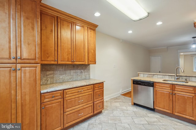 kitchen with dishwasher, sink, light stone countertops, and backsplash